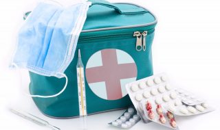 medicine chest and tablets on the white background